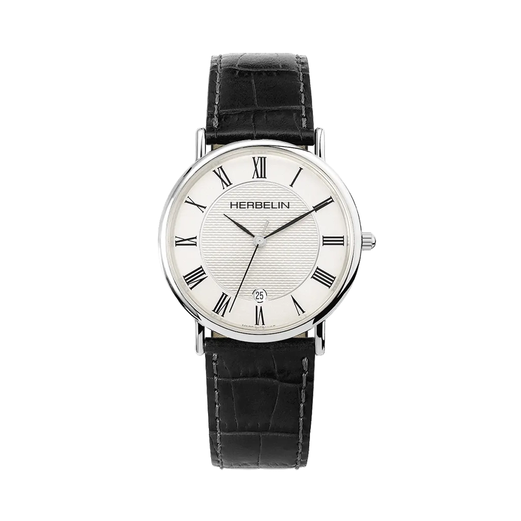 Et klassisk ur til både dame og herre med diameter på 38 mm. Den hvite skiven har romertall og dato kl 6, og kassen er i stål med sort skinnrem.
