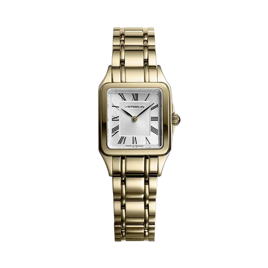 Herbelin Luna er en klassisk dameklokke i gullfarget stål med hvit skive, romertall og lenke. 