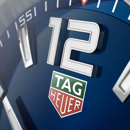 TAG Heuer Formula 1 WAZ1118.BA0875 til herre med kasse og lenke i stål og blå skive.
