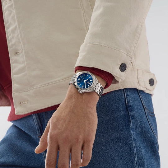 TAG Heuer Formula 1 WAZ1118.BA0875 til herre med kasse og lenke i stål og blå skive.