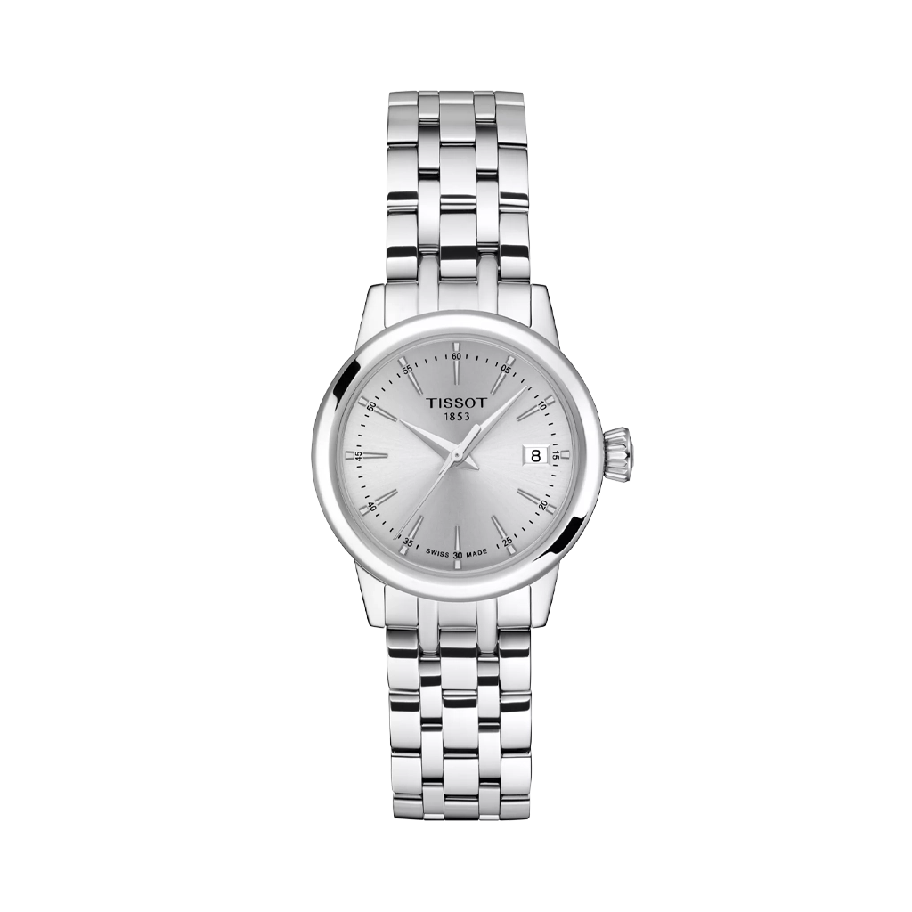 Tissot Classic Dream er en dameklokke på 28 mm. Klokken i stål har en grå tallskive med dato kl 3. Lenken i stål har butterfly clasp. 50 meter vanntett.
