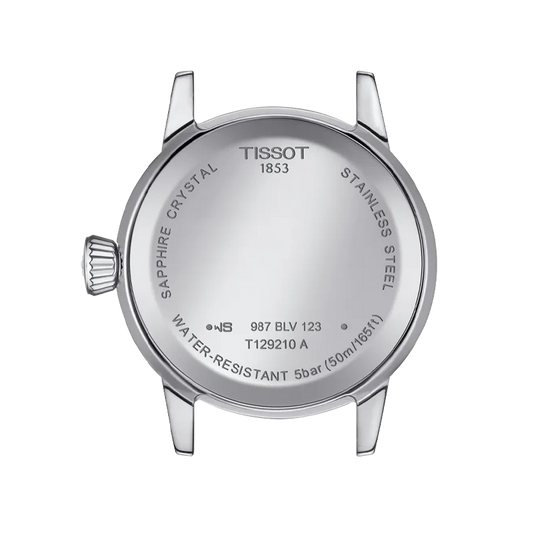 Tissot Classic Dream er en dameklokke på 28 mm. Klokken i stål har en grå tallskive med dato kl 3. Lenken i stål har butterfly clasp. 50 meter vanntett.